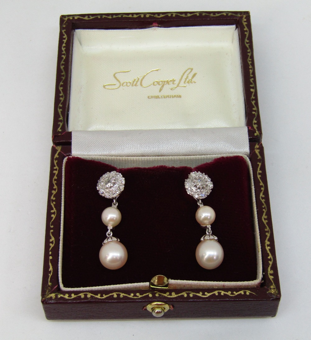 Good quality pair of convertible 18ct white gold 'night and day' earrings composed of diamond