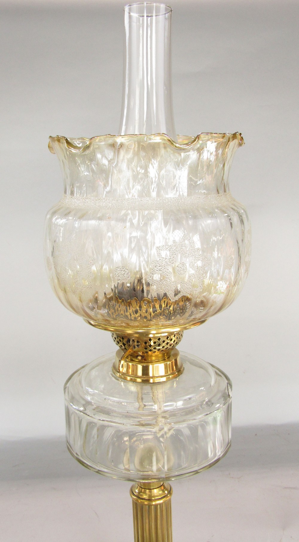 A brass table standing oil lamp, the reeded column on a stepped frame with moulded glass font, - Image 2 of 3