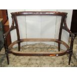 A good quality Regency style two seat sofa frame with carved detail and shaped and moulded outline