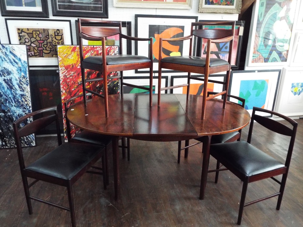 A. H. McIntosh of Kirkcaldy - extending dining table, with six chairs including two carvers with