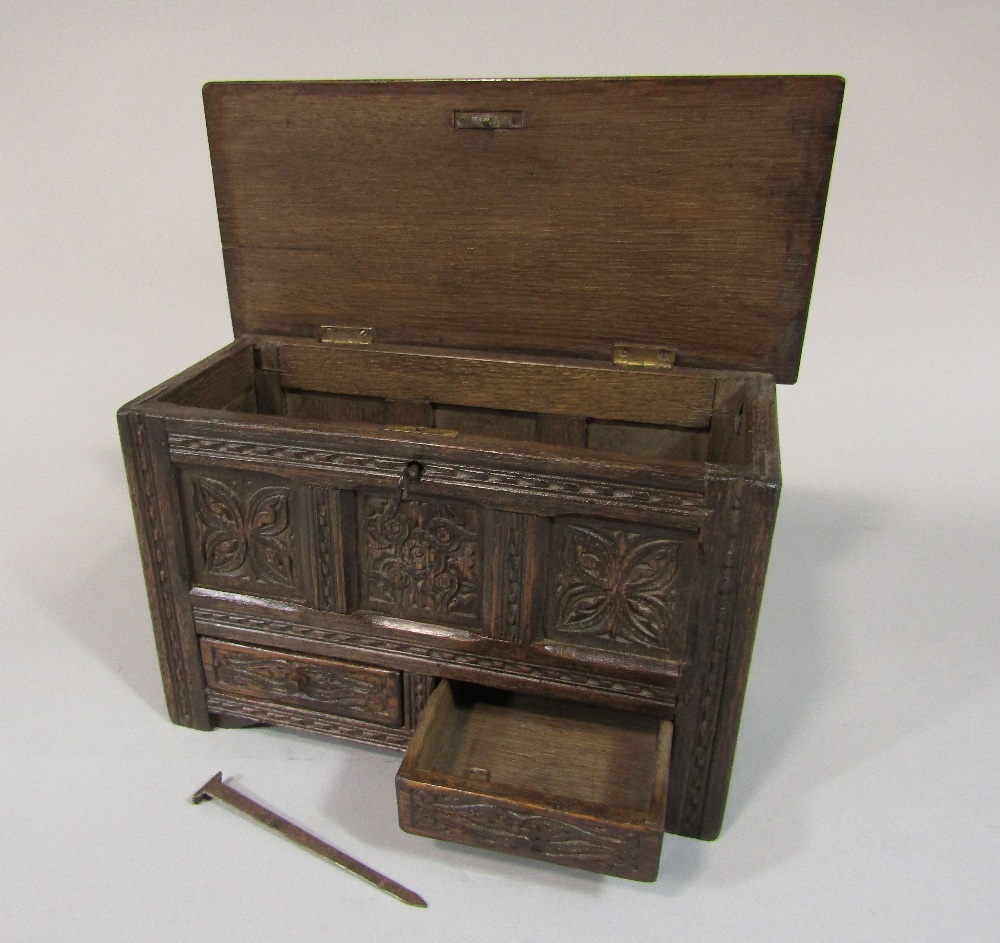 Apprentice mule chest, with rising lid over two frieze drawers, the panelled framework with carved - Image 2 of 2