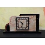 Art Deco marble mantel clock of stylised form, 43cm long
