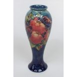 A Moorcroft blue ground vase of shouldered form with finch and fruit pattern, with impressed mark