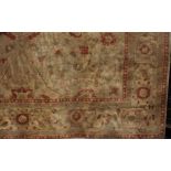 Large Caucasian country house carpet with typical red floral sprays upon an ivory ground, over 400