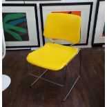 Matrix Krueger stacking chair with yellow moulded plastic upon a chrome frame, 82cm high