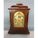 Mahogany cased twin train bracket type clock, striking on a gong, engraved brass chapter ring,