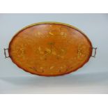 An Edwardian satinwood serving tray with marquetry and pen work decoration of instruments,