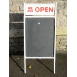 A vintage A framed painted metal shop exterior sign board, with painted twin flap 'We Are Open'