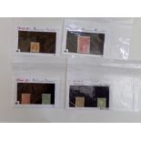 Four cards containing a mixture of high value foreign stamps - USA, Australia, Luxembourg, etc (