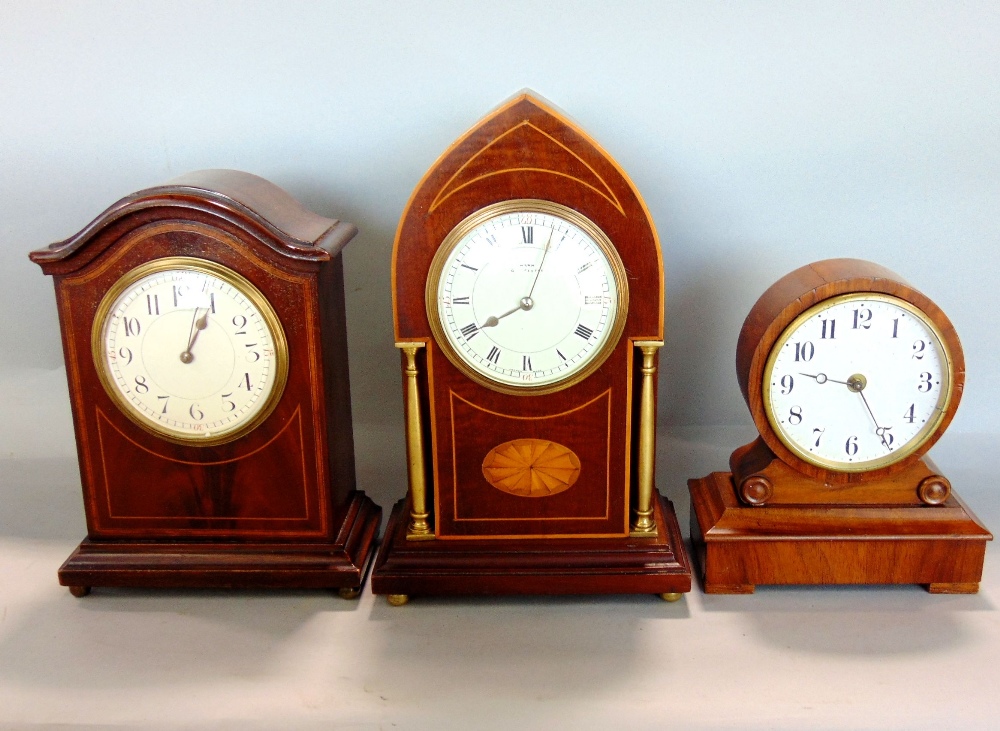 Three small Edwardian timepieces to include a drumhead mantel clock, a lancet clock with brass