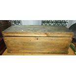 A vintage stripped pine carpenters box with hinged lid and removeable segmented trays, containing
