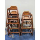A stack of childs cafe high chairs