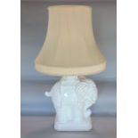Italian Blanc de Chine porcelain elephant converted into a lamp, upon a stepped square base, potters