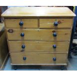 A Victorian stripped pine bedroom chest of two short over three long graduated drawers, with