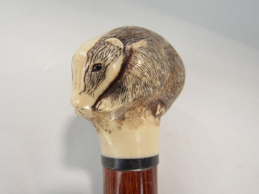 A walking cane, the knop in the form of a hares head, another with a badger mount (both resin) - Image 3 of 3