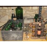 A collection of glass bottles, a Lexicon 80 vintage typewriter, steel two branch pricket candle wall