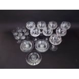 A set of eight large drinking glasses with etched fruiting vine decoration, together with a