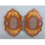 A pair of box wood inlaid mahogany hanging frames of oval form, 34 cm high (2)