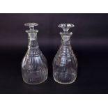 Two 19th century cut glass decanters and stoppers, both with faceted detail, 25 cm approx height