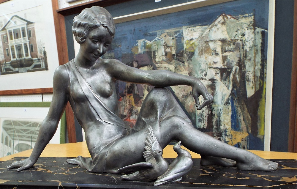 After Godard - Cast spelter figure of a recumbent lady with two doves, upon a stepped square