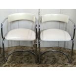 A pair of cantilever chairs with tubular chrome frame and cream faux leather upholstered pad