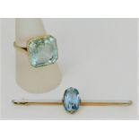 Early 20th century 15ct bar brooch set with an oval aquamarine, 6.5cm long approx, together with a