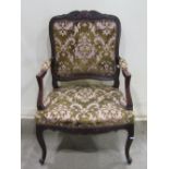 A late 19th century French open armchair with cut floral maquette upholstered seat and back pad