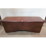 A six plank coffer in Deal, with stained finish raised on shaped supports, 150cm wide
