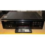 A Denon compact disc player model DCD1550AR, complete with remote control