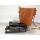 A pair of German Beck Kassel 'Tordalk' 11 x 80 binoculars with strap, eye protector and fitted case