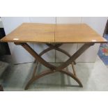 A coaching table in oak, of usual form, with folding action 92cm max