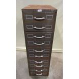 A vintage steel floorstanding filing cabinet fitted with a tower of ten index drawers, 132 cm high x