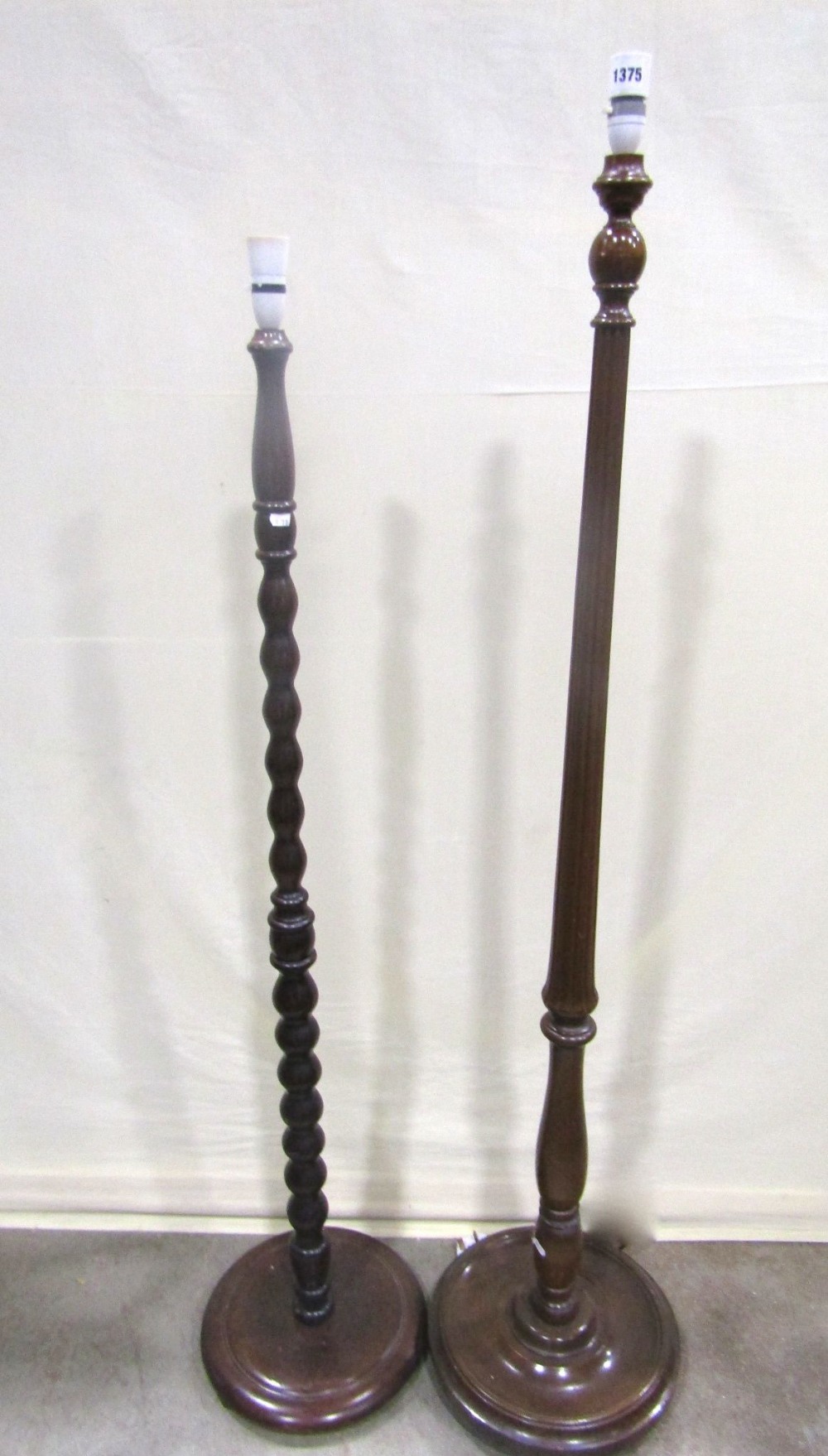 Two lamp standards, one with reeded, one with bobbin column