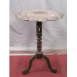 A papier mache Kashmir occasional table, the circular top with fluted borders, raised on a turned