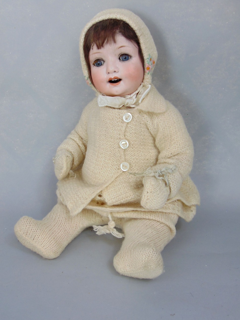 Vintage German bisque headed doll marked '300' with closing eyes, jointed limbs, open mouth and