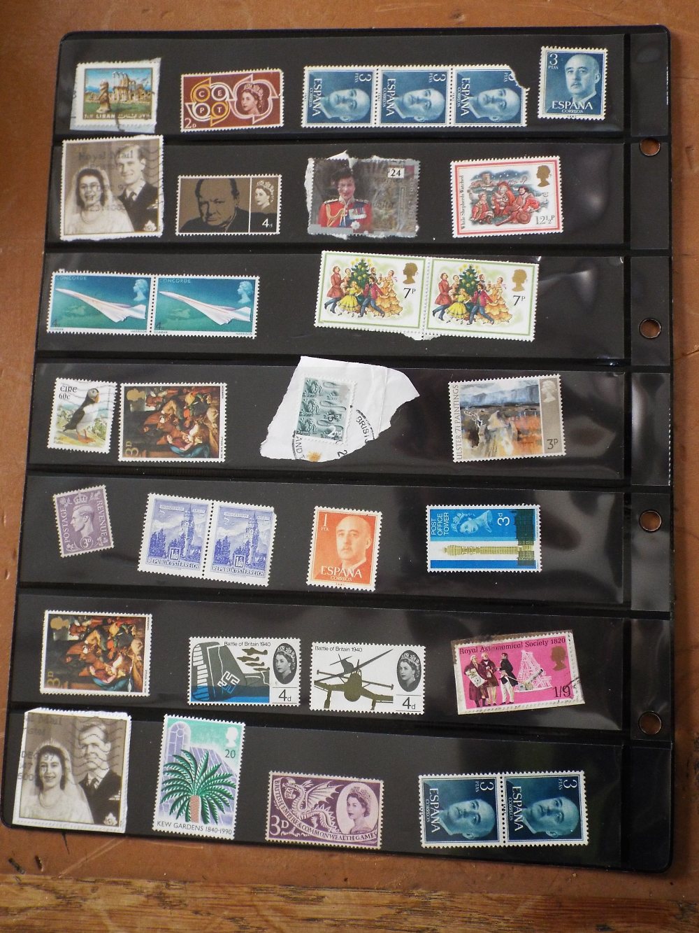 Three sheets of mostly British stamps, some mint together with a pocket watch and winder (4) (