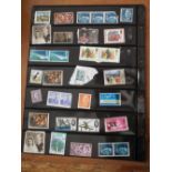 Three sheets of mostly British stamps, some mint together with a pocket watch and winder (4) (
