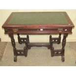 A late Victorian aesthetic period writing table of rectangular form, with inset top over a frieze