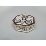 A 19th century ink stand in the Samson manner of octagonal form, with painted and gilded floral