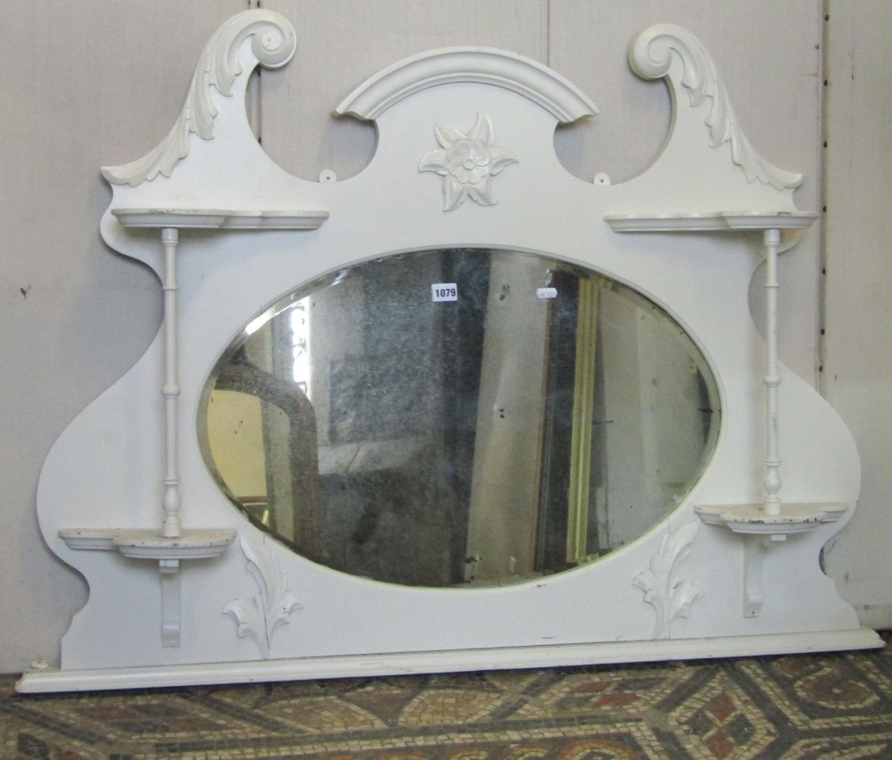 Three Edwardian overmantel mirrors of varying size and design, with moulded and carved detail, one