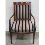 A good quality Regency or Empire style open elbow chair with alternating striped patterned