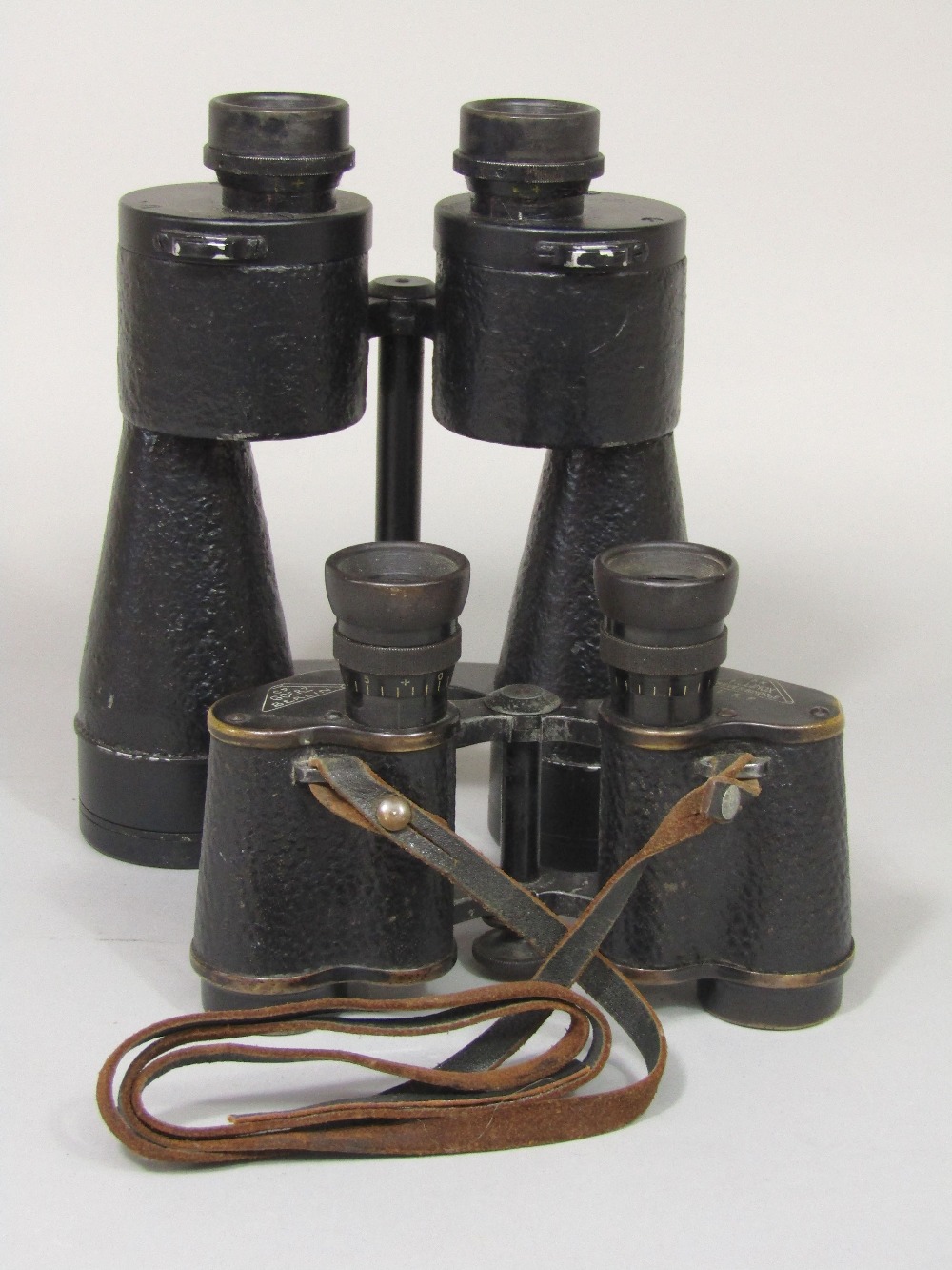 Two pairs of binoculars to include German Goerz 6 x 30 with strap and a pair 7 x 50 (unknown