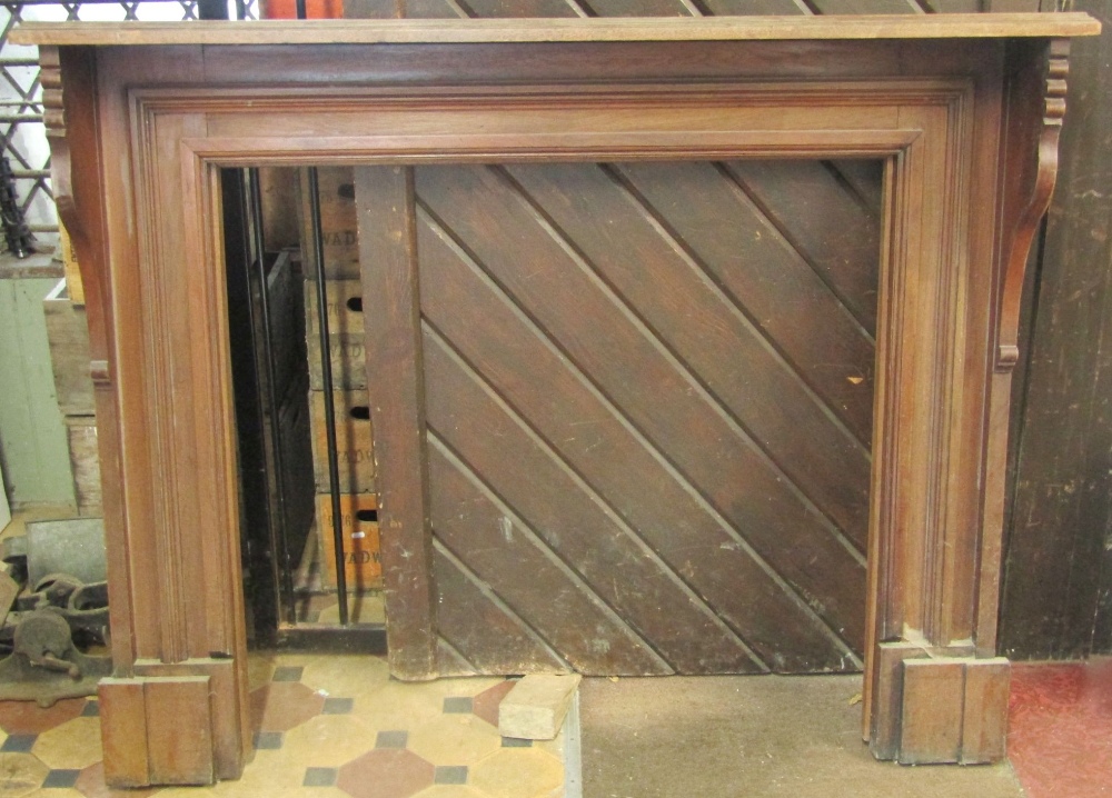 An Edwardian walnut fire surround with moulded frame and shaped brackets, the mantle 153 cm wide, - Image 2 of 2