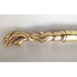 A walking cane, the knop in the form of a brass dragon