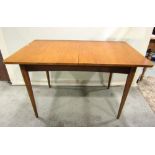 A teak and stained beechwood pullout extending dining table of rectangular form, with single