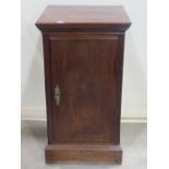 A mahogany floorstanding pedestal side cupboard, enclosed by a rectangular door, with brass fixed