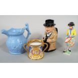 A Royal Doulton toby jug in the form of Winston Churchill, a Shelley loving cup commemorating the