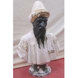 An old weathered plaster bust of a cleric or scholar, with turban headdress, 90cm high approx