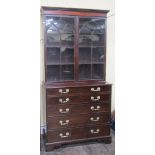 An early 19th century mahogany secretaire bookcase, th lower section enclosed by four long