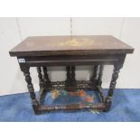 An Old English style oak and walnut foldover top occasional table with double gate action, raised on